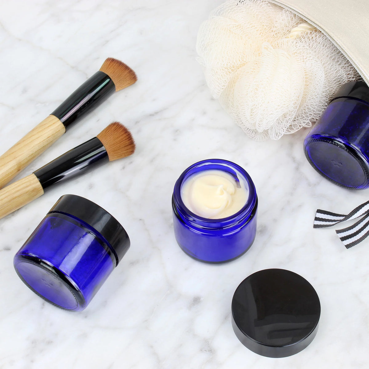 2 oz Cobalt Blue Glass Cosmetic Jars 12-Pack with Black Lined Lids W600